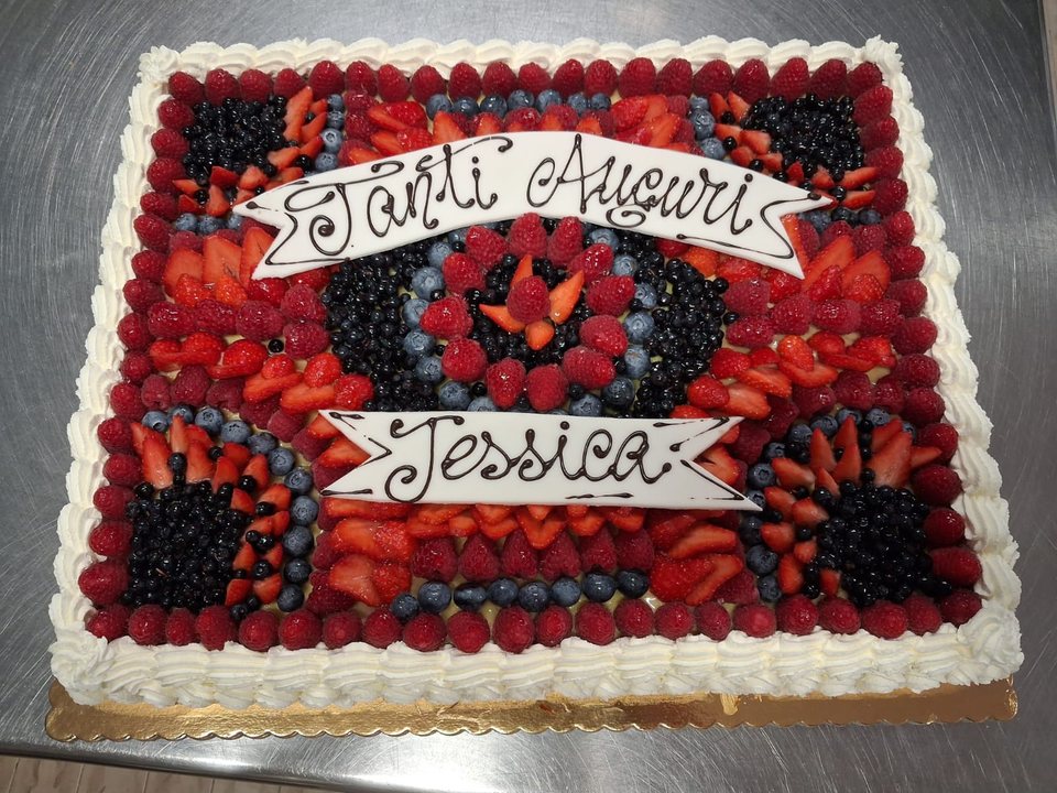Rectangular mixed berry birthday cake with a personalised message