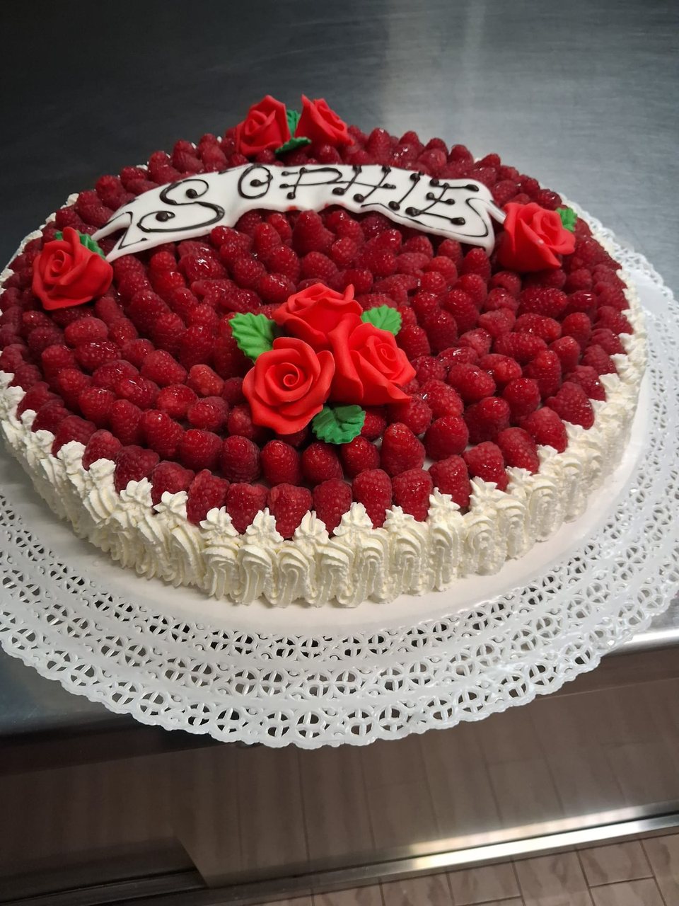 Raspberry cake with cream, red roses and a personalised message